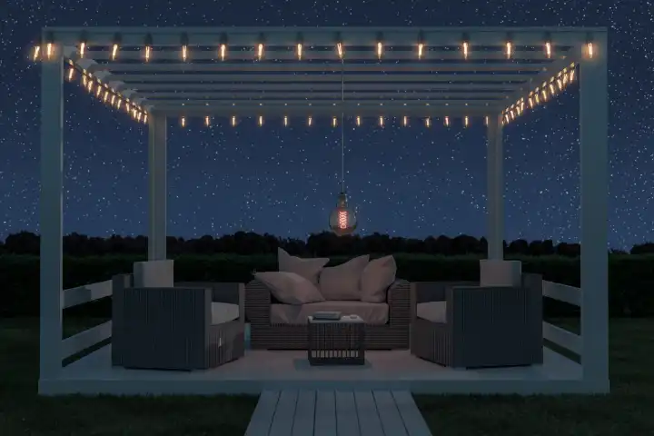 Weißes Terrassendach mit Rattan-Sofa draußen auf der grünen Wiese unter sternenklaren Nachthimmel
