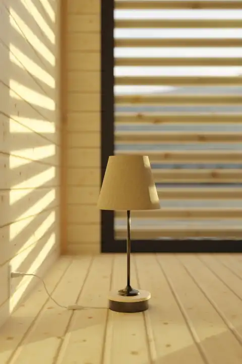 Wooden bedside lamp on wooden floorboards in the evening light
