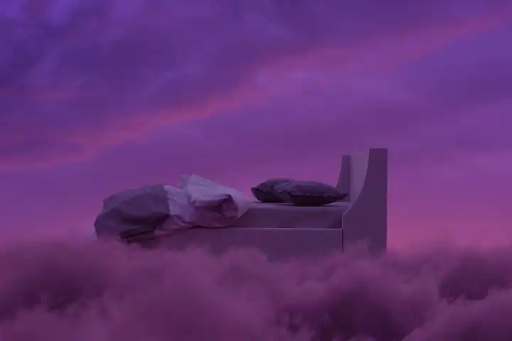 Cozy bed above fluffy purple clouds