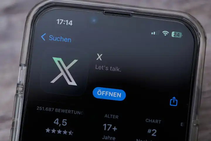 Mainz, Germany - August 02, 2023: icon of the twitter app with the new X logo on a German smartphone in app store