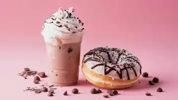 ai generative illustration of a frappé drink with a doughnut on a pink background