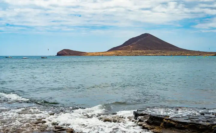 Montana Roja, a mountain in El Medano, in the popular surfing spot of Tenerife South.