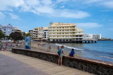 El Medano, Tenerife, Spain - April 22, 2024: people at the beach of El Medano, the surfing spot of Tenerife, Spain