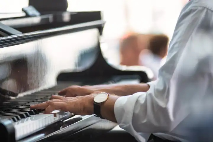 Detachment of a pianist's hands on the keyboard during a performance
