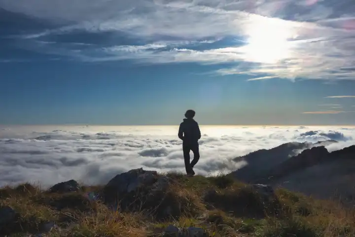 Loneliness in the mountains above a sea of clouds