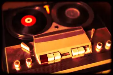 Old vintage reel tape recorder. Simulated vintage photography