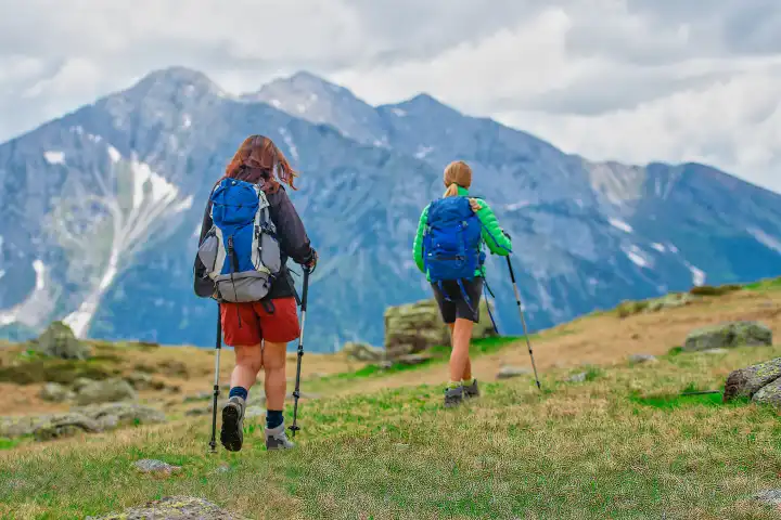 Two female friends during a mountain excursion.