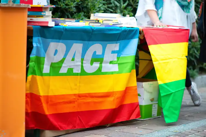 Signature collection table with rainbow peace flag