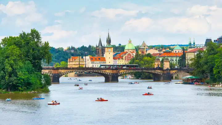 Prague, Czech Republic - 5 September 2019: Tourists with pedaloes on the Vltava river in Prague