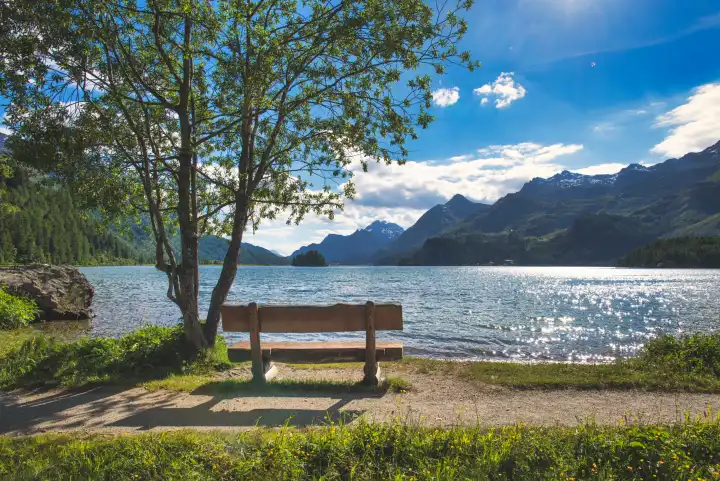 Wooden tourist bench to contemplate nature in the mountains