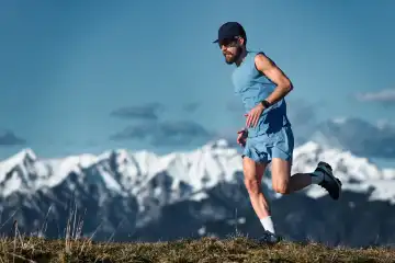 Mountain running a man training alone