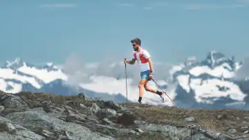 Mountain athlete soars to high altitude in the Italian Alps