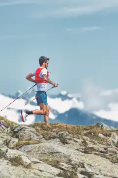 Mountain athlete soars to high altitude in the Italian Alps