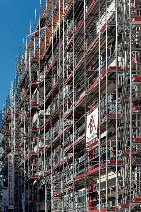 Symbolic image real estate and construction: scaffolding on a house facade