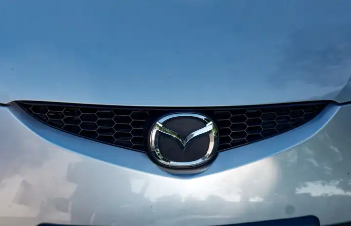 Automotive industry, symbol image: radiator grille with Mazda brand emblem
