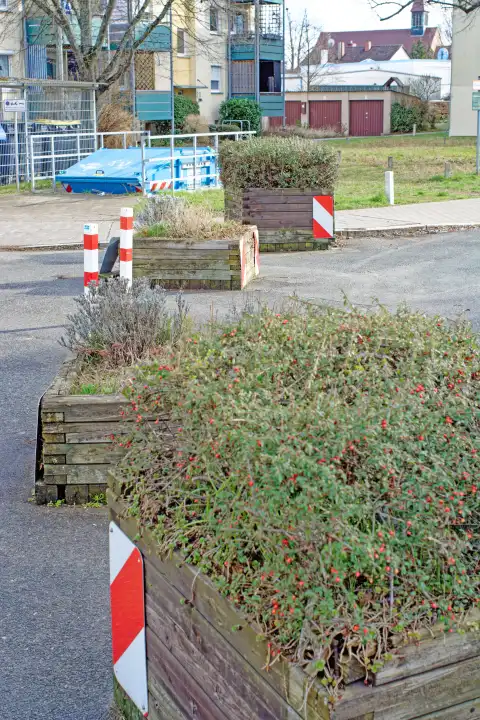 Closing a road to through traffic with plant troughs and posts