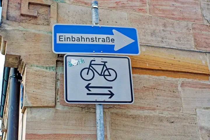 One-way street sign with bicycle traffic permitted in both directions