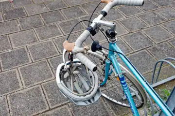 Safety in traffic: bicycle helmet hanging on the handlebars of a bicycle
