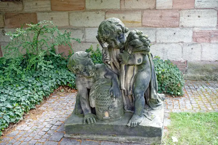 Sandstone sculpture in the Mayor's Garden on the city wall in Nuremberg, Bavaria, Germany