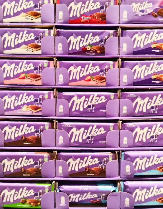 Kiel, Germany - 16. October 2022: A display with different types of chocolate from the Milka company in a supermarket