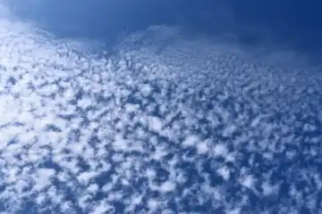 Stunning cirrus cloud formation panorama in a deep blue summer sky seen over Europe