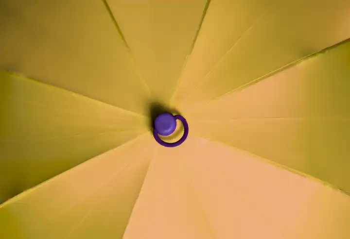 Close up view at the colorful surface of a rainproof umbrella
