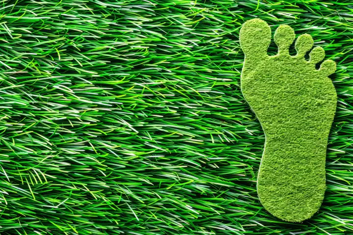 Ein grüner Fußabdruck, der umweltfreundliches Verhalten zeigt, generiert mit KI