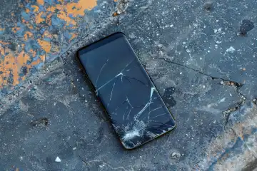 A new smartphone with a broken display lying on the floor, generated with AI