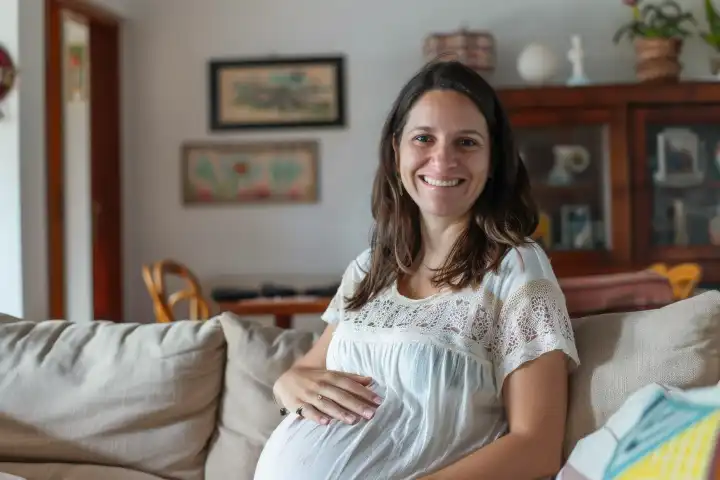 A pregnant woman in her living room looking happy, generated with AI