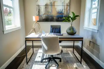 A well organized home office with a sleek desk comfortable chair, generated with AI