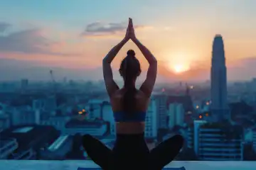 A woman performing a morning yoga pose on a rooftop overlooking a bustling cityscape, generated with AI