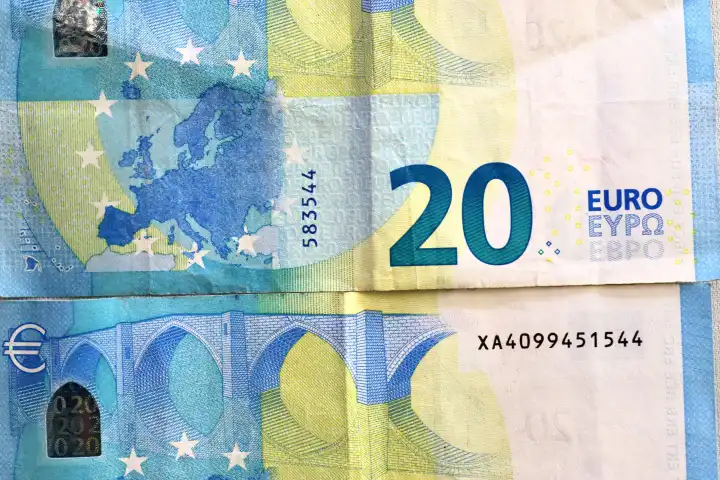 Close up of numerous euro banknotes lying on top of each other