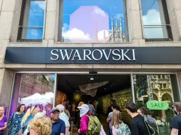 Munich, Germany - 22 June 2024: The entrance area of a Swarowski brand shop in Munich city centre