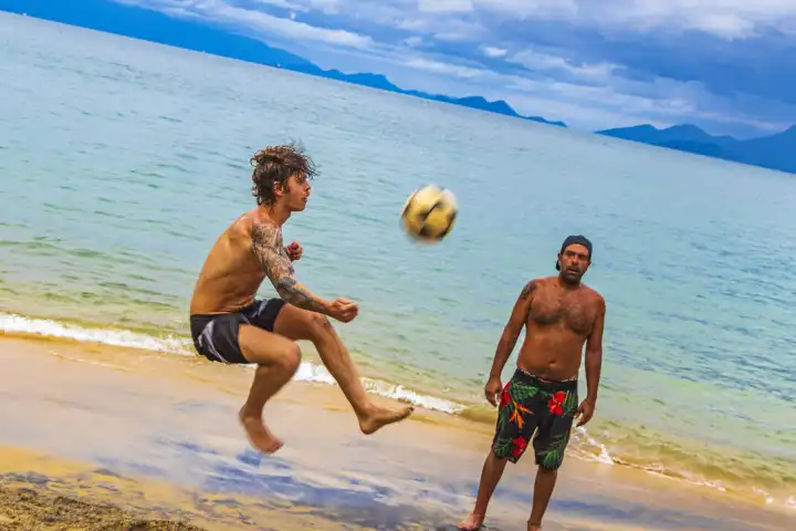 Ilha Grande Brazil 23. November 2020 Male soccer players at the big tropical island Ilha Grande Praia de Palmas beach in Angra dos Reis Rio de Janeiro Brazil.