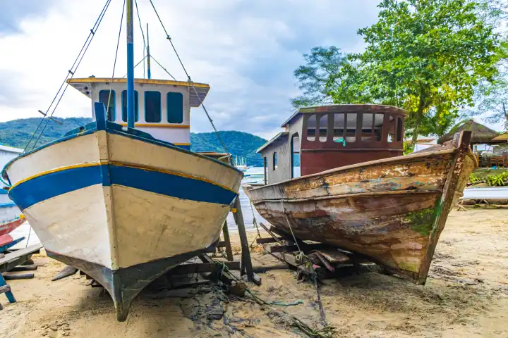 Old oats ships and boats for restoration in Abraao beach Ilha Grande Angra dos Reis Rio de Janeiro Brazil.