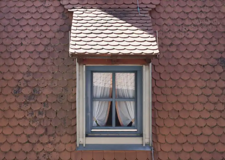 ancient traditional dormer window on the roof