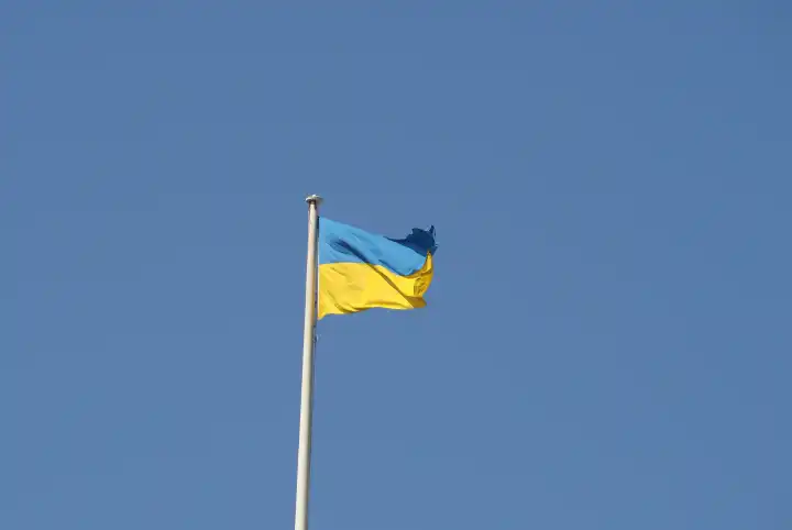 the Ukrainian national flag of Ukraine, Europe over blue sky