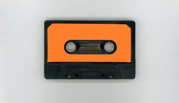 magnetic tape cassette with blank orange label