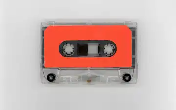magnetic tape cassette with blank orange label