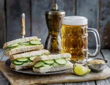 cucumber sandwiches traditional british food with beer and tea, AI generated image