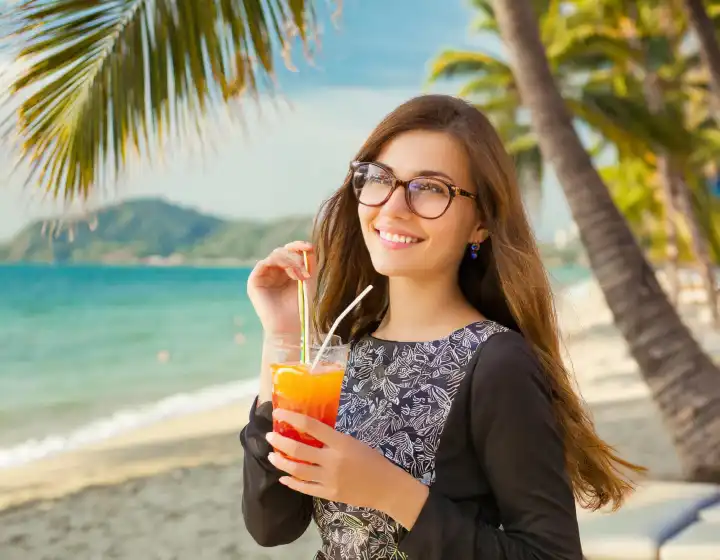 beautiful woman with cocktail on the beach, AI generated image