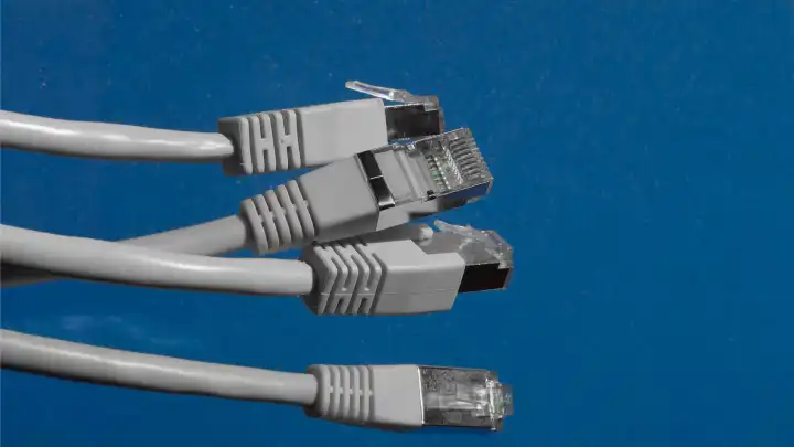 RJ45 network cables with copy space blue background