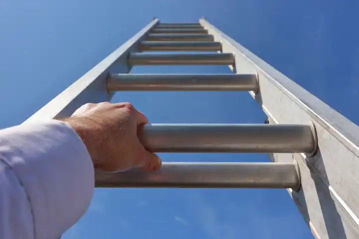 Concept image of hands climbing a ladder to the sky