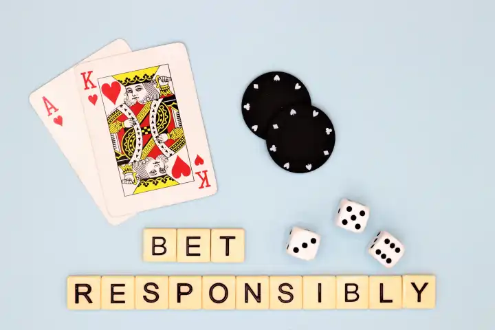 Bet Responsible, Game Aware, Glücksspiel-Bilder auf blauem Hintergrund