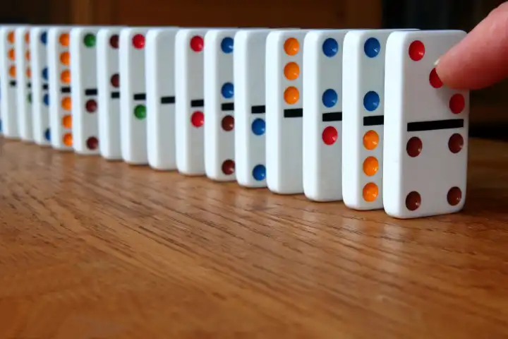 Line of dominoes ready to be pushed