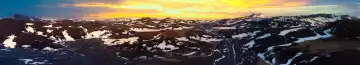 Aerial view of mountain ranges with snow and ice in the highlands of Iceland