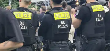 Three policemen from behind